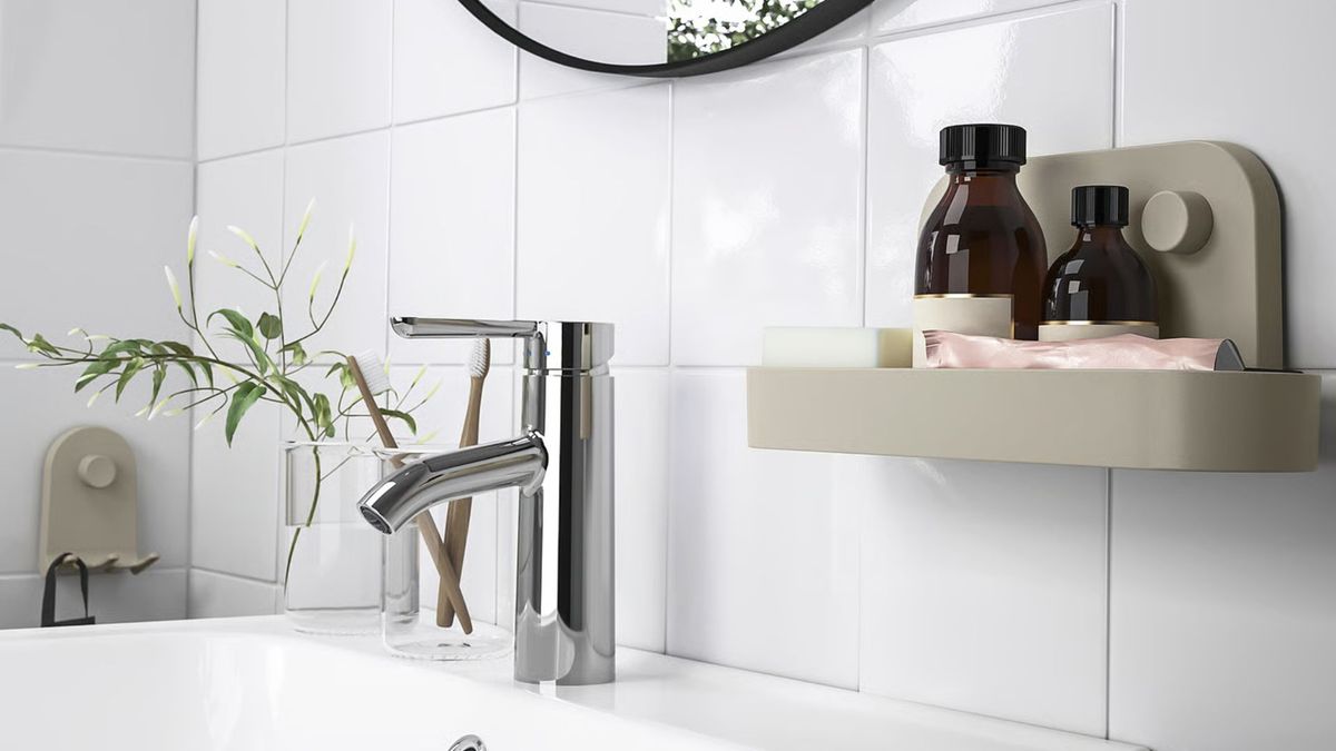 I’ve got a tiny bathroom with no storage space — IKEA’s $5 suction wall shelf stores all my clutter