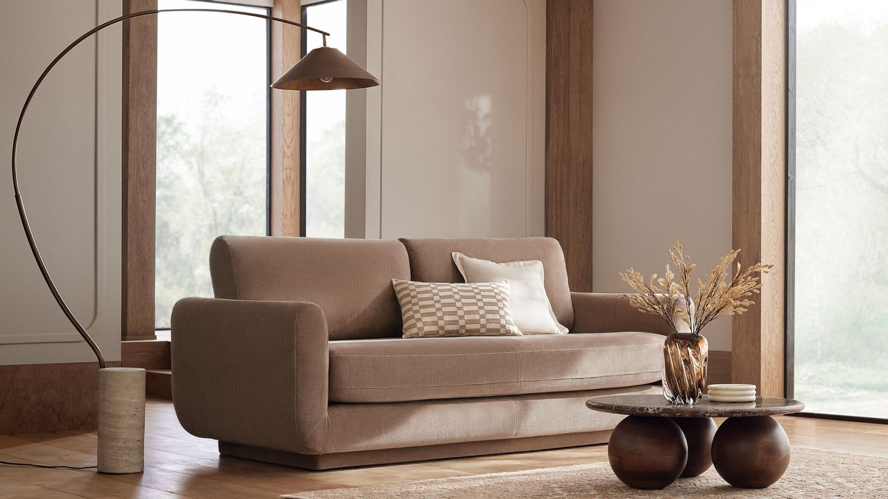 Next lamp and neutral sofa with orb coffee table