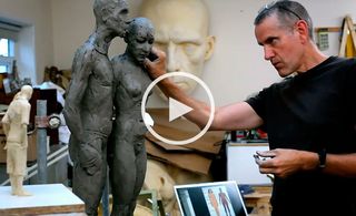 Artist making new sculpture of a couple.