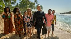 Murder Mystery 2. (L-R) Zurin Villanueva as Imani, Jodie Turner-Smith as Countess, Kuhoo Verma as Saira, Jennifer Aniston as Audrey Spitz, Mark Strong as Miller, Adam Sandler as Nick Spitz and Enrique Arce as Francisco in Murder Mystery 2