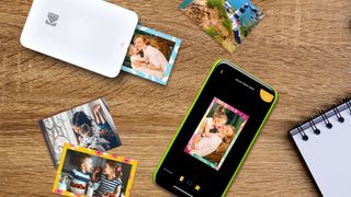 Kodak STEP Slim mobile photo printer next to cell phone