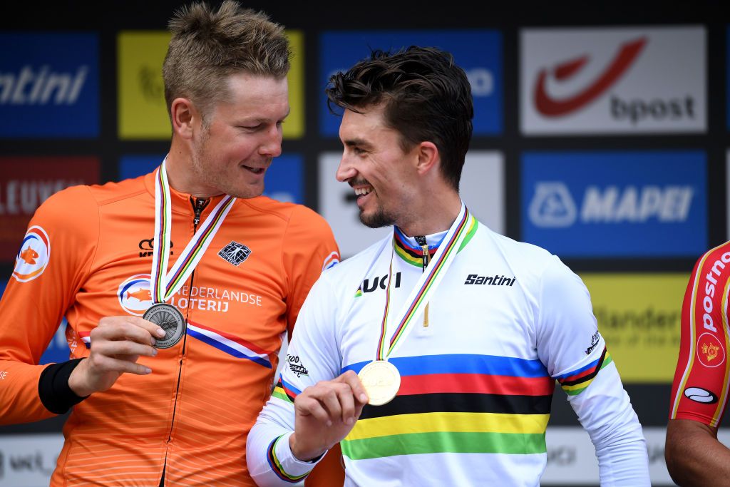 LEUVEN BELGIUM SEPTEMBER 26 LR Silver medalist Dylan Van Baarle of The Netherlands and gold medalist Julian Alaphilippe of France pose on the podium during the medal ceremony after the 94th UCI Road World Championships 2021 Men Elite Road Race a 2683km race from Antwerp to Leuven flanders2021 on September 26 2021 in Leuven Belgium Photo by Tim de WaeleGetty Images