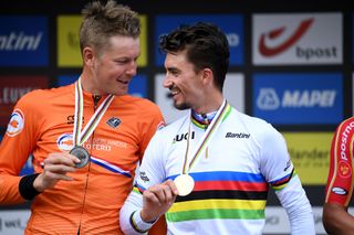 LEUVEN BELGIUM SEPTEMBER 26 LR Silver medalist Dylan Van Baarle of The Netherlands and gold medalist Julian Alaphilippe of France pose on the podium during the medal ceremony after the 94th UCI Road World Championships 2021 Men Elite Road Race a 2683km race from Antwerp to Leuven flanders2021 on September 26 2021 in Leuven Belgium Photo by Tim de WaeleGetty Images