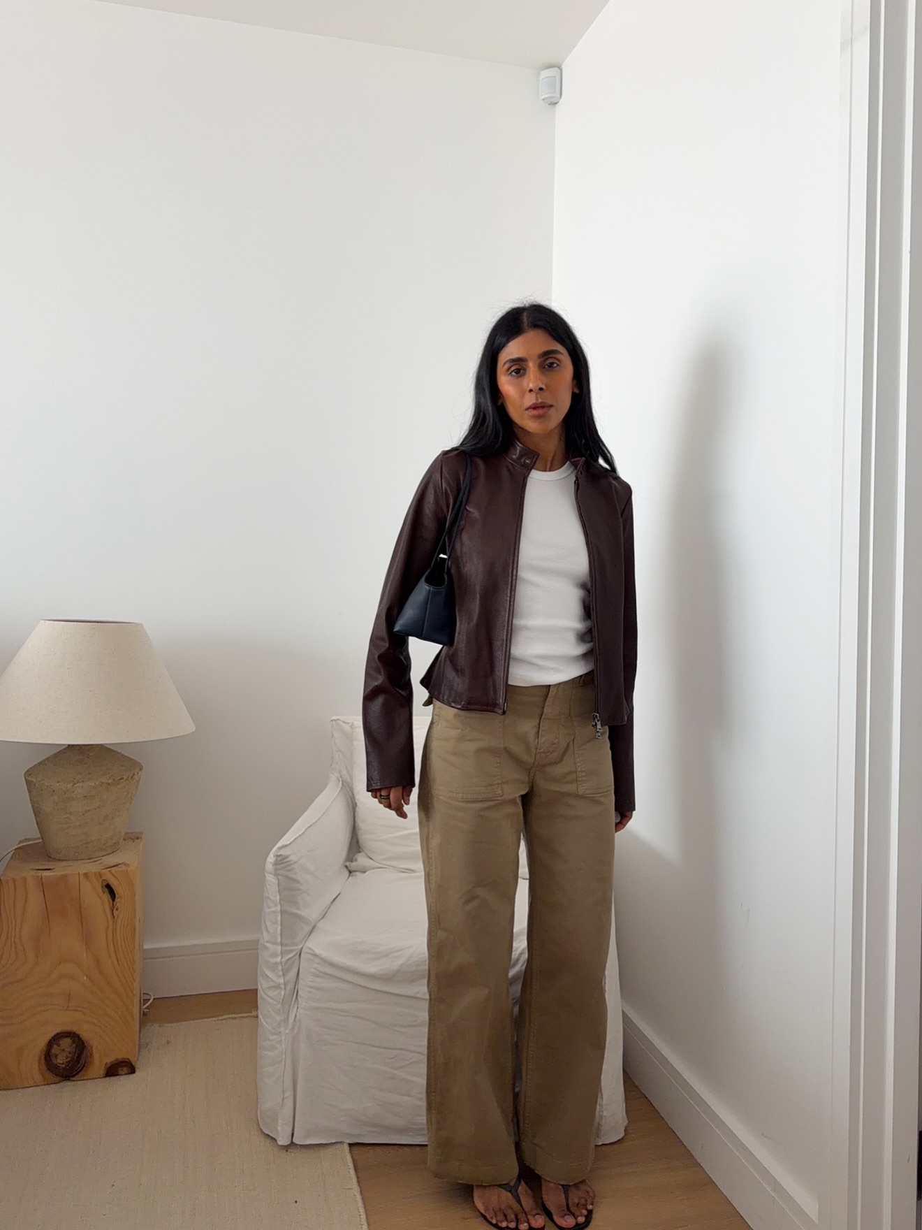 An image of @monikh wearing khaki jeans, one of the biggest summer jeans trends of 2026.