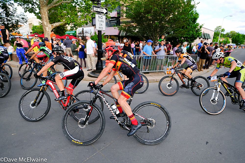 Riders round the final turn on the course with two laps remaining