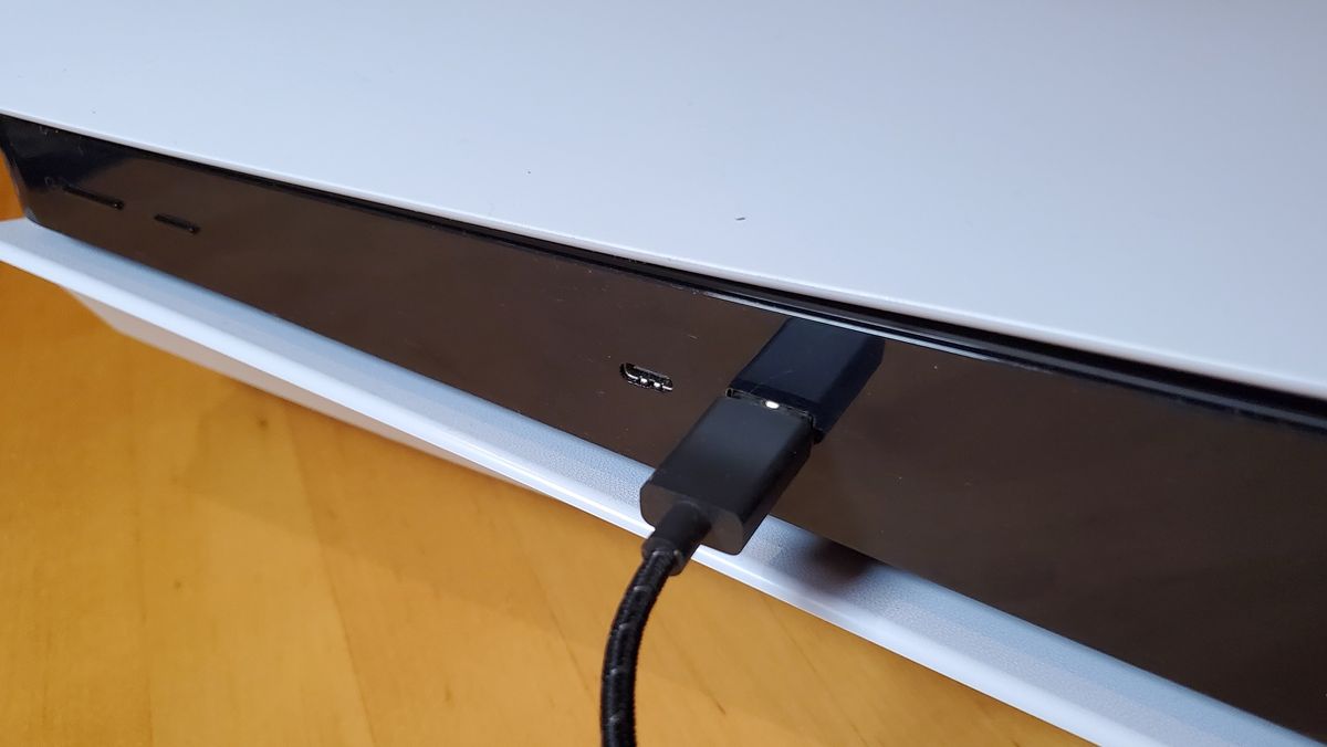 PS5 with USB-C cable plugged into front port