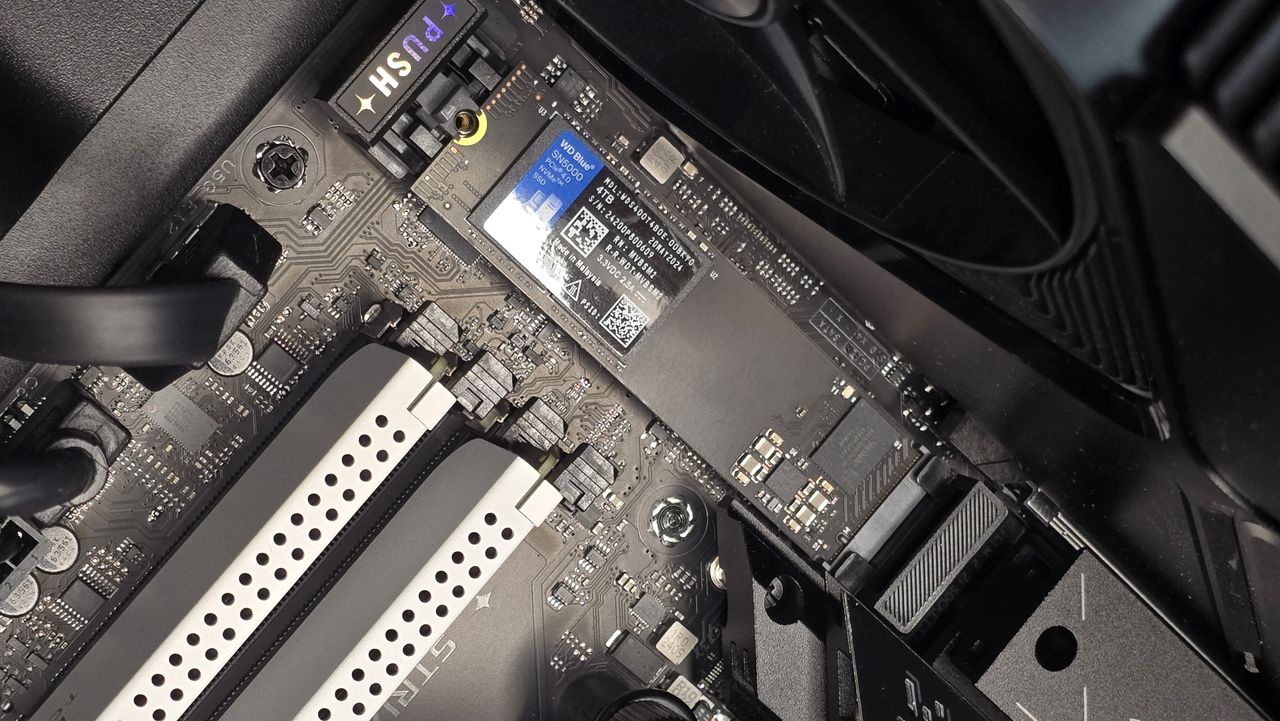 A WD SN5000 SSD out of its box and installed in a PC's NVMe slot.