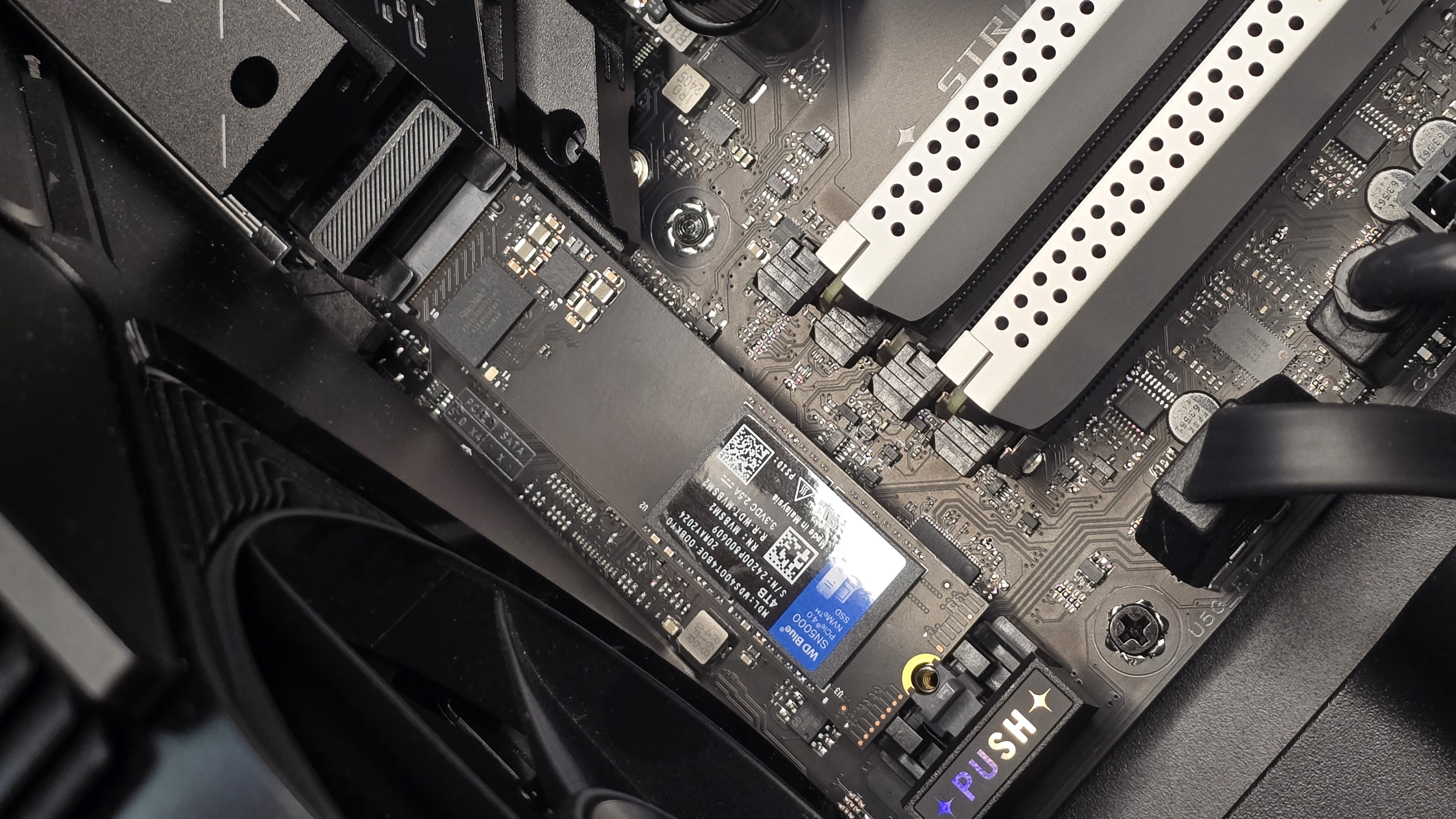 A WD SN5000 SSD out of its box and installed in a PC's NVMe slot.