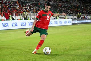 Morocco AFCON 2023 squad: Achraf Hakimi kicks the ball during the Africa Cup of Nations (CAN) 2024 group F football match between Morocco and Tanzania at Stade Laurent Pokou in San Pedro on January 17, 2024. (Photo by SIA KAMBOU / AFP) (Photo by SIA KAMBOU/AFP via Getty Images)