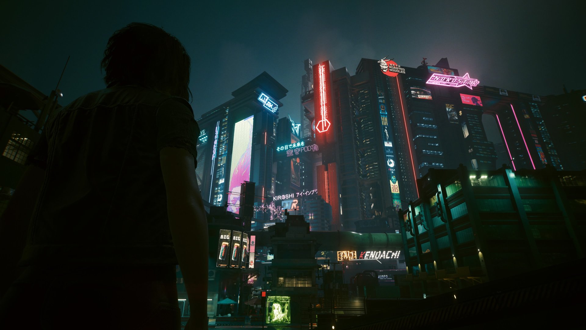 Cyberpunk 2077 screenshot showing V looking out over Night City at night