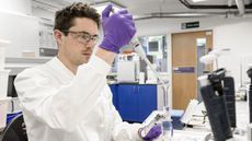 Young Laureate Joseph Cookextracting bacteria and mineralsfrom a water sample.