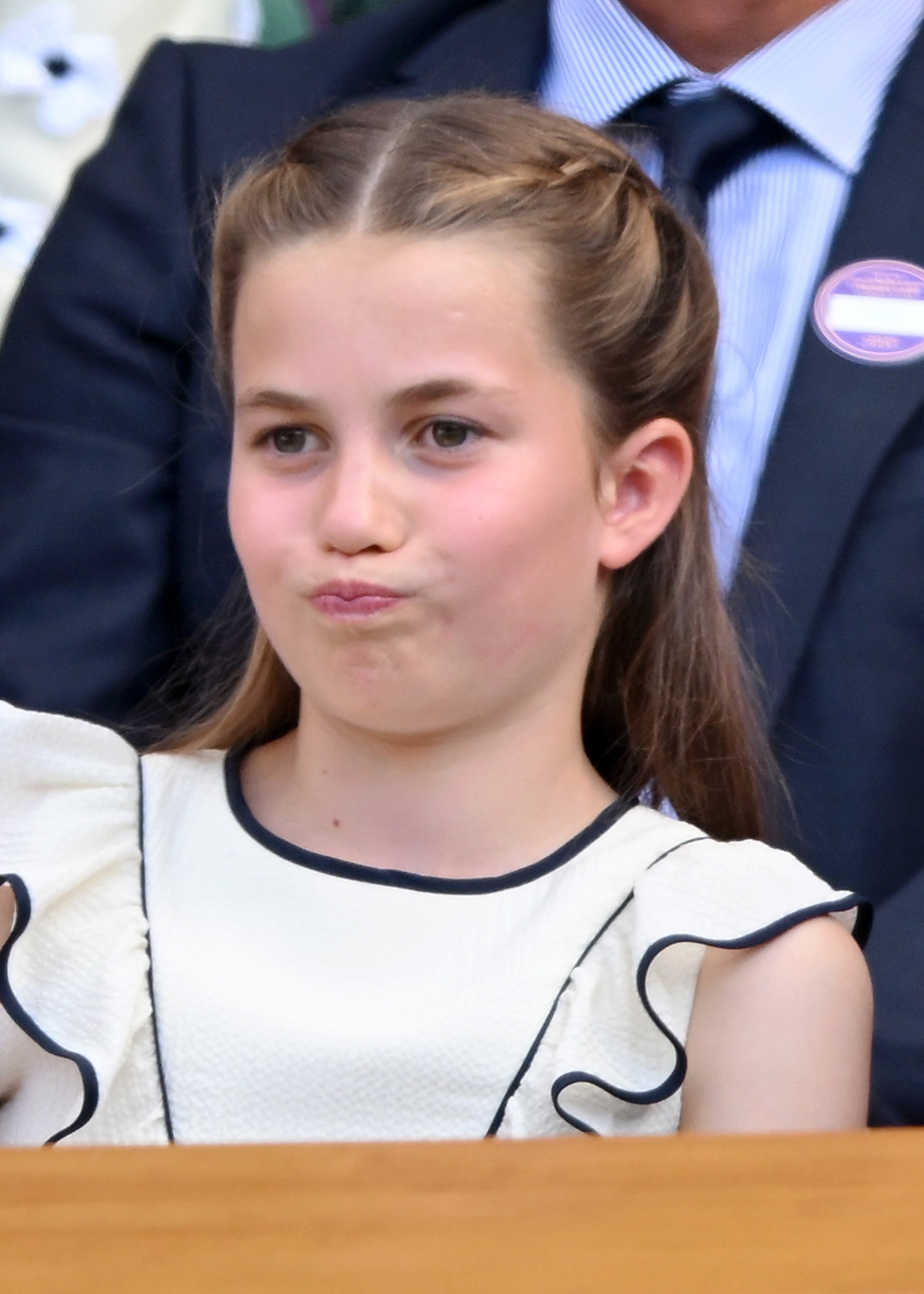 Princess Charlotte at Wimbledon making funny facial expressions