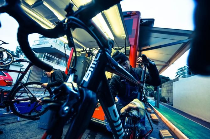 The team mechanics have a busy evening ahead of them after a long stage and transfer