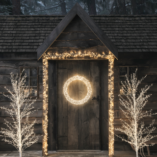 lights around door with light up wreath and trees