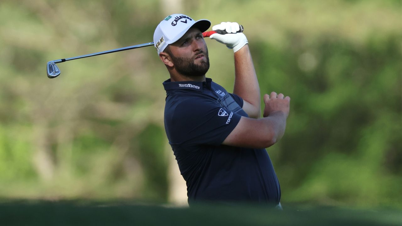 Jon Rahm hitting his tee shot at the 12th hole of Augusta National during round one of the 2022 Masters