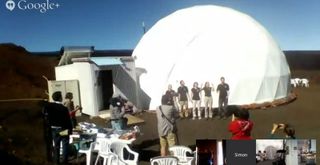 This still from a HI-SEAS 2 mission webcast shows the mock Mars mission crewmembers just after exiting their habitat on July 25, 2014 after four months living inside a dome on Hawaii's Mauna Loa volcano.