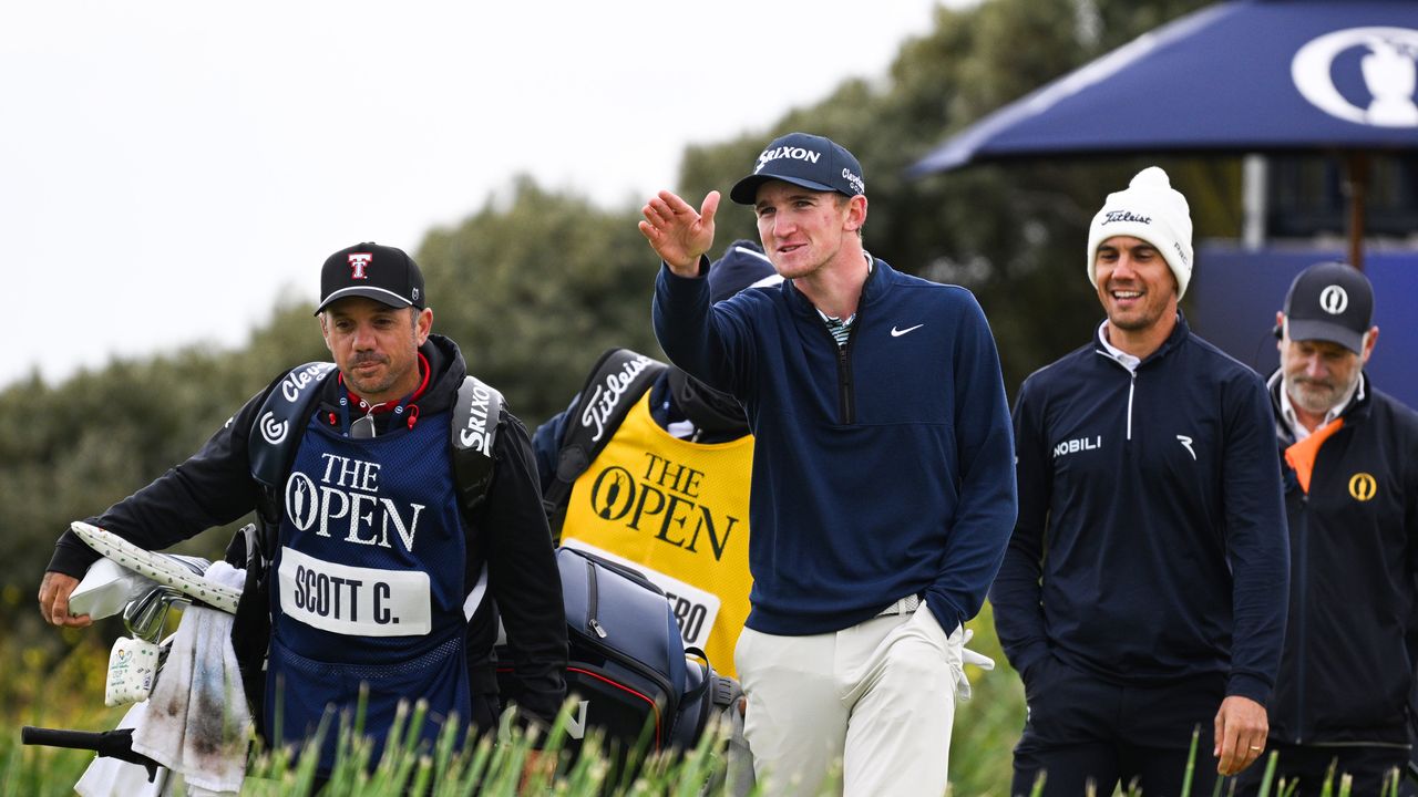 Calum Scott points to something in the distance on day four of the 152nd Open Championship at Royal Troon