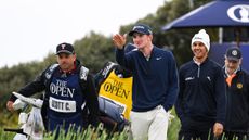 Calum Scott points to something in the distance on day four of the 152nd Open Championship at Royal Troon