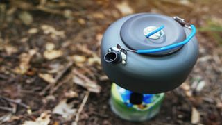 A camping kettle on a stove