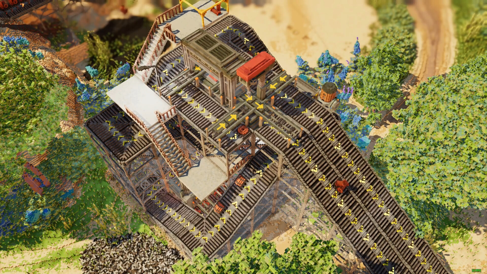 Screenshot from Dawn Apart of a factory line set outside with forestry surroundings 