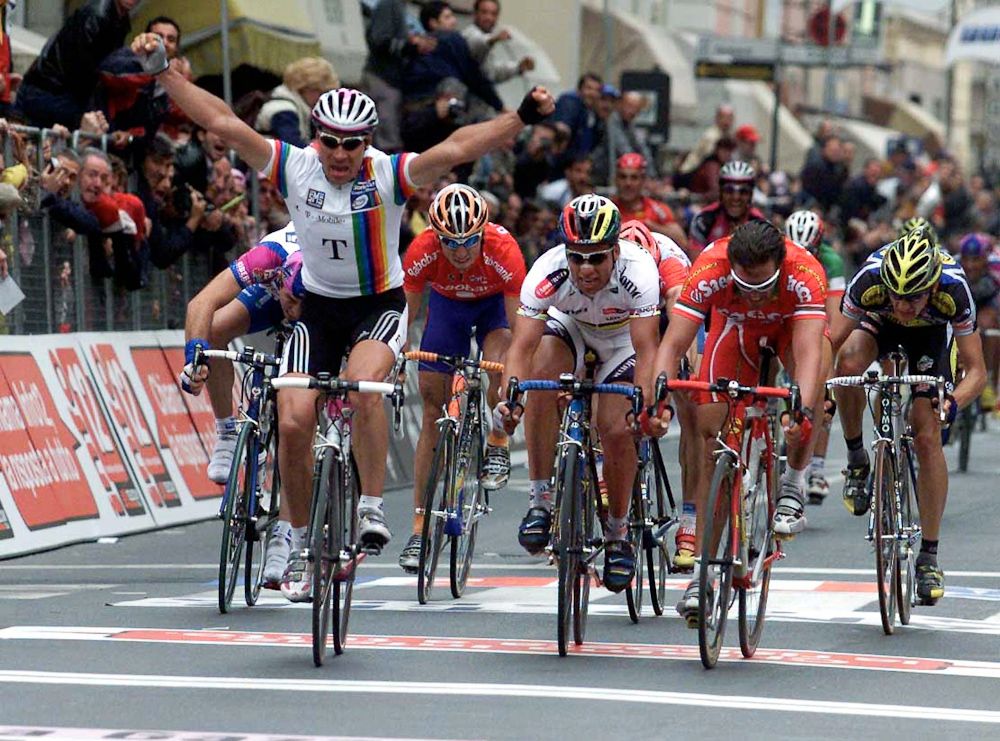 World Cup leader Erik Zabel (T-Mobile) on his way to beating Romans Vainsteins (Domo Farm Frites) and Mario Cippolini (Saeco) at Milan-San Remo in 2001.