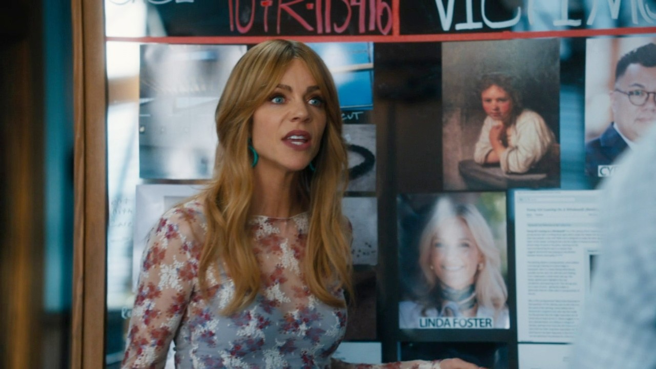 Kaitlin Olson talking in front of a board in High Potential.