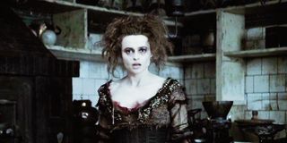 Mrs. Lovett (Helena Bonham Carter) stands in the kitchen in 'Sweeney Todd'