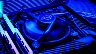 An Intel-branded CPU fan on a motherboard, lit in blue