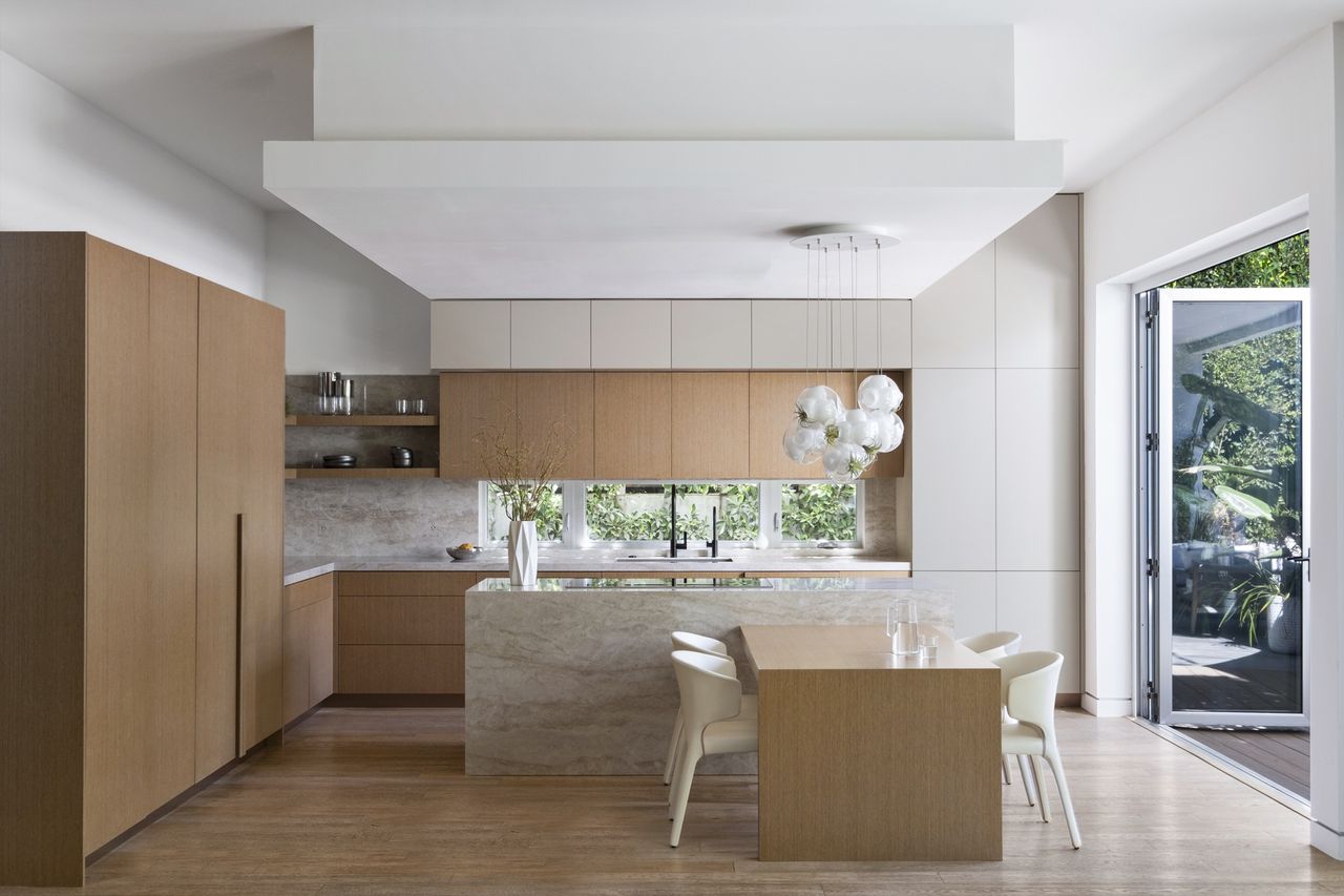 Californian kitchen with wood cabinets and marble backsplash by Victoria Holly Interiors