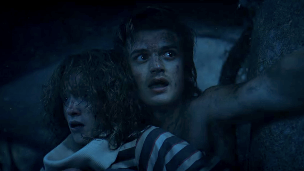 Nancy and Steve cling upside down on Stranger Things Season 4