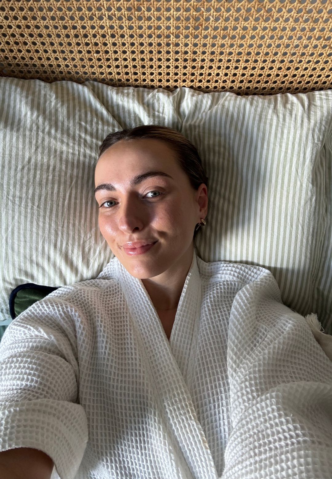 Health writer Georgia Brown on her bed after trying ten minutes of pre-bed yoga