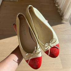 tan Chanel flats with a red cap toe from The Vintage Marche