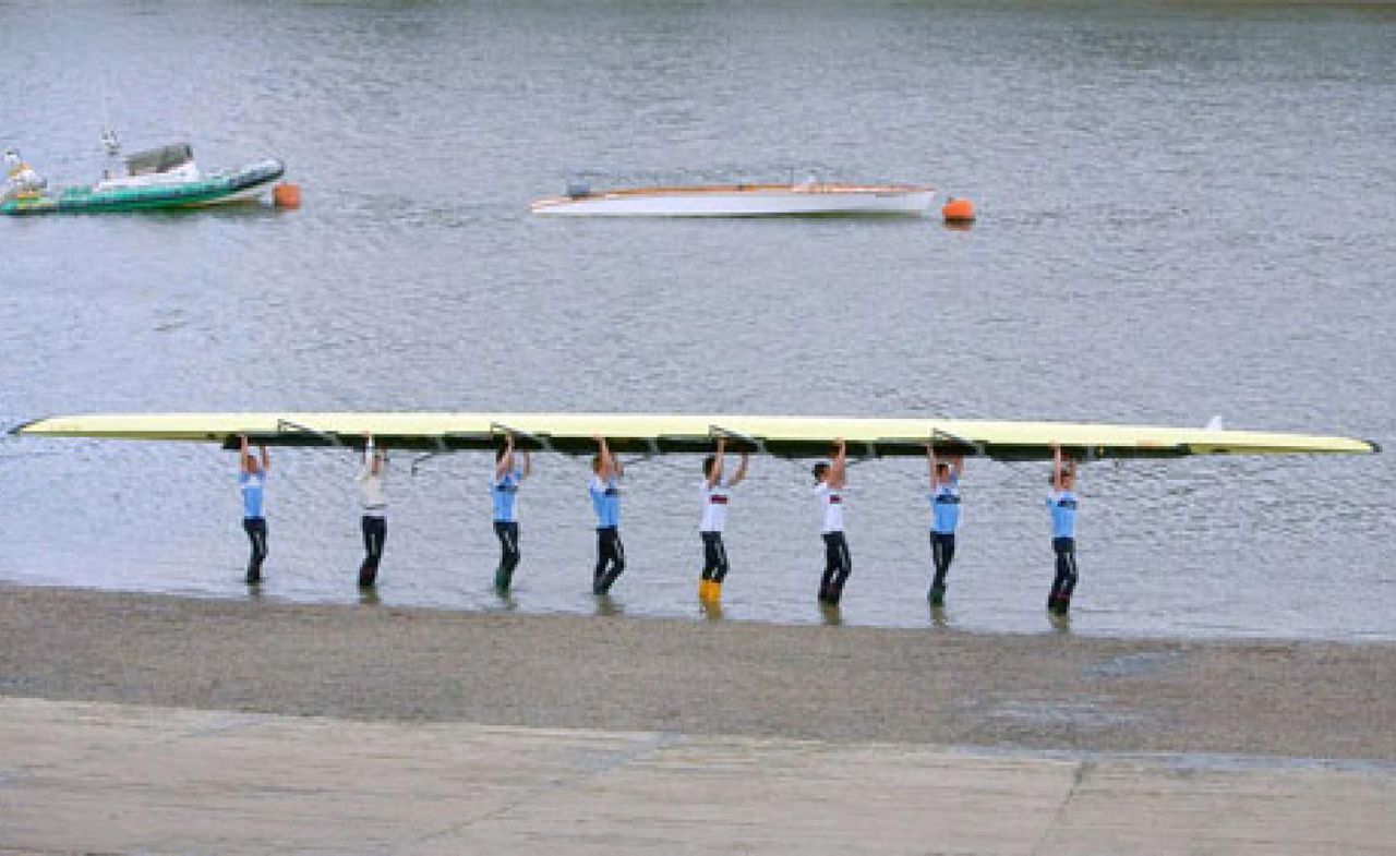 People carrying the boat