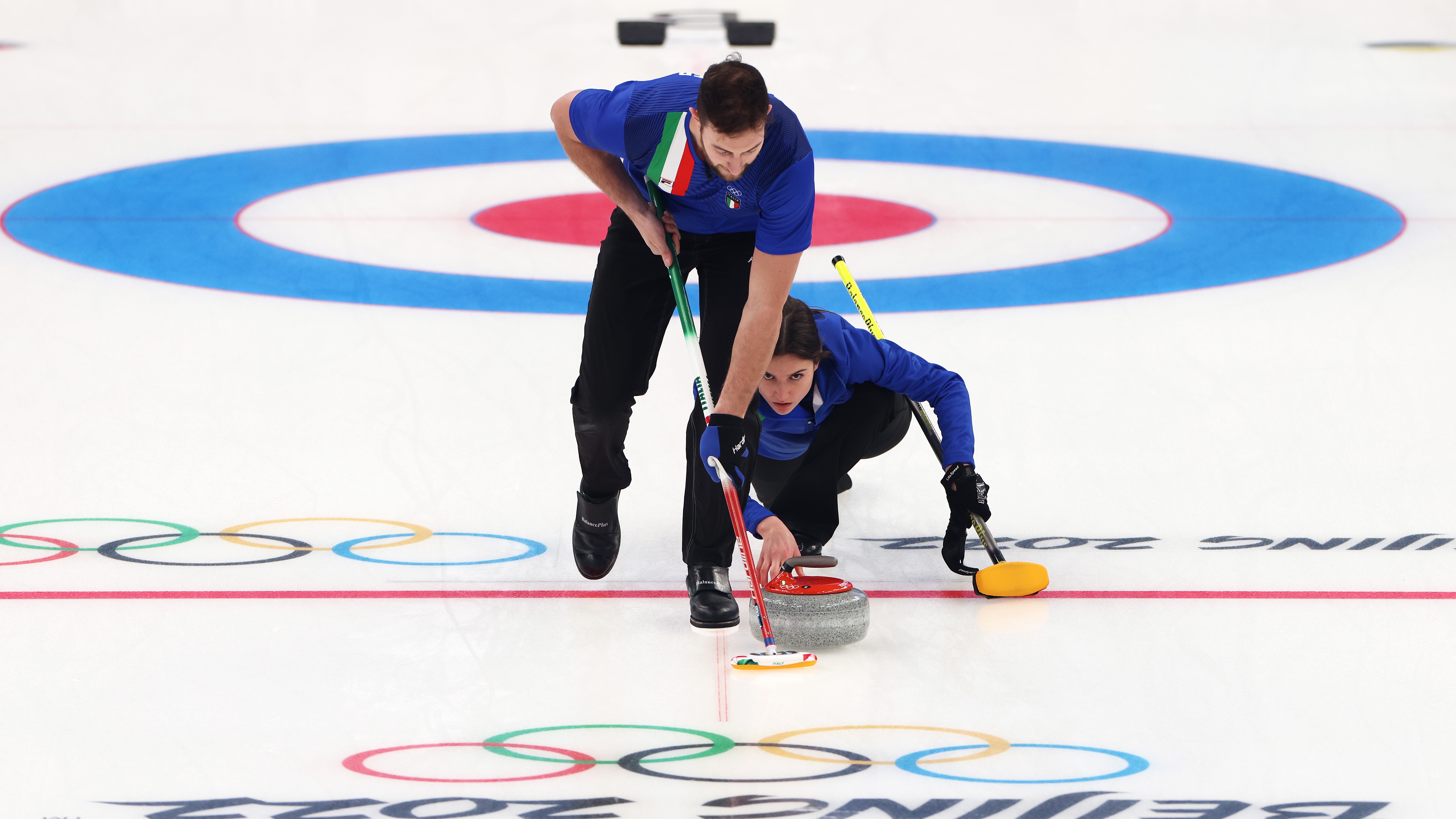 Amos Mosaner and Stefania Constantini of Team Italy compete against Team Sweden during the Curling Mixed Doubles Round Robin on Day 2 of the Beijing 2022 Winter Olympics at National Aquatics Centre on February 06, 2022 in Beijing, China. 