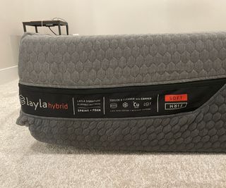 Close up of the Layla Hybrid mattress, with the flippable sides indicates on the label