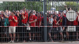 Fans of Liverpool queue outside the stadium ahead of the 2022 UEFA Champions League final between Liverpool and Real Madrid at the Stade de France on 28 May, 2022 in Paris, France.