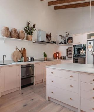 Pink kitchen configured in a kitchen triangle