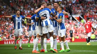 Brighton players celebrate a Pascal Gross goal against Manchester United at Old Trafford.