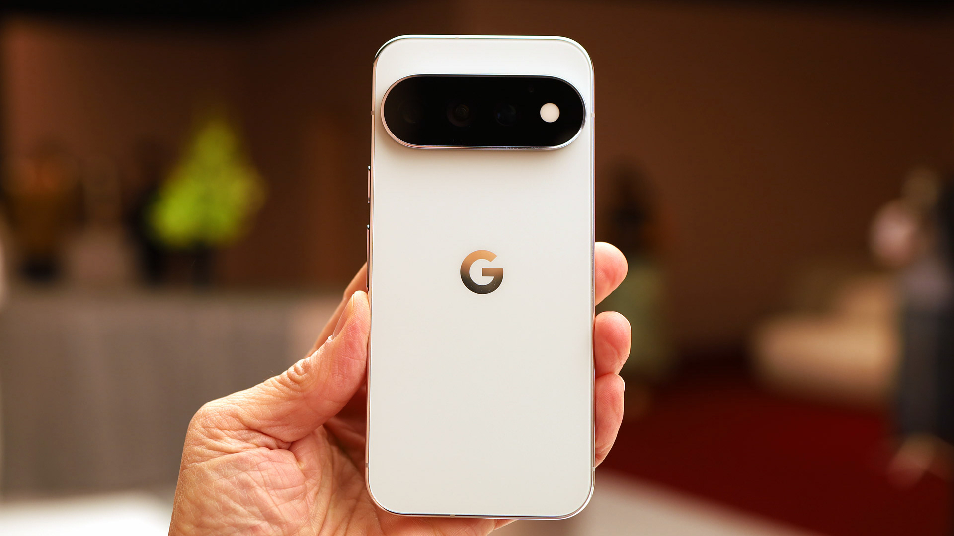 Google Pixel 11 Pro Hands On, showing the rear of the device in its smart white and gold finish