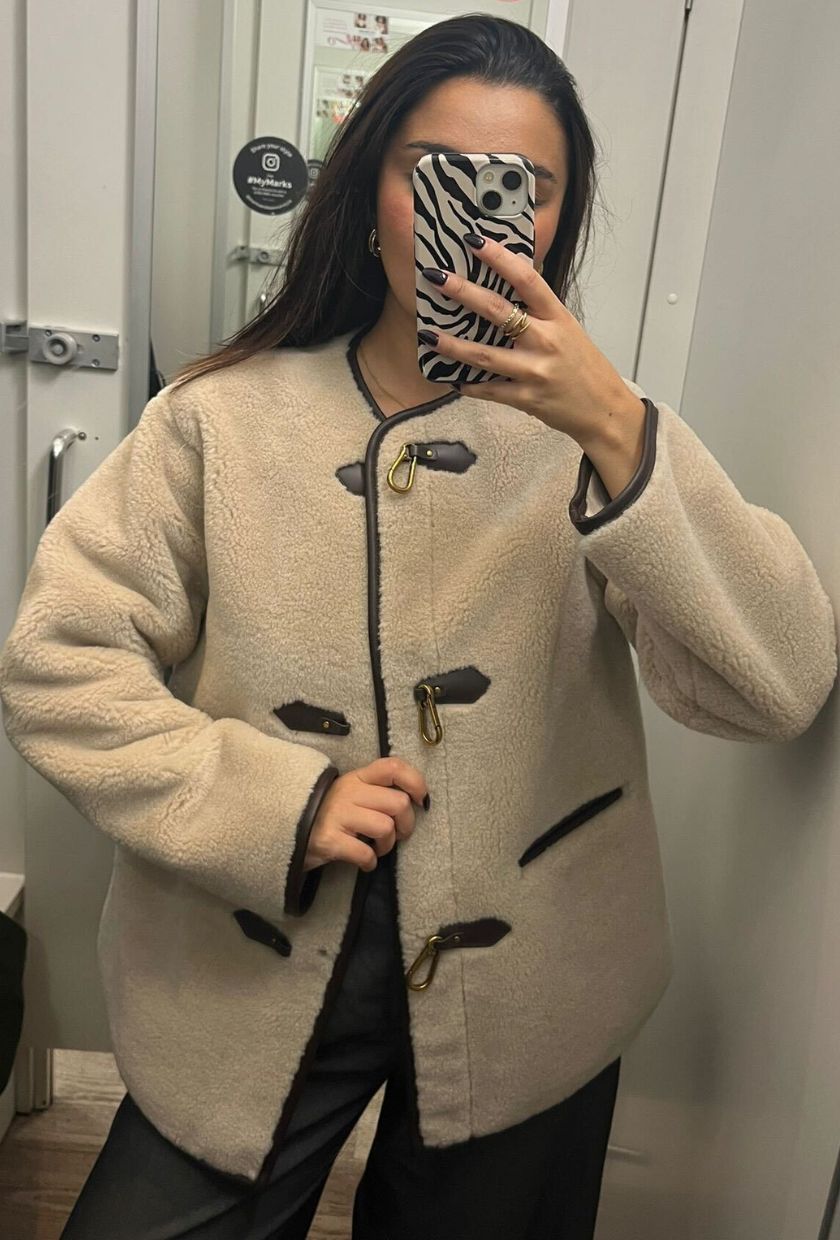 Senior Shopping Editor, Marina Avraam wears M&S' faux-fur buckle trim coat (£75).