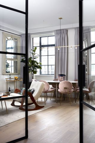 modern apartment dining room by K&H Design