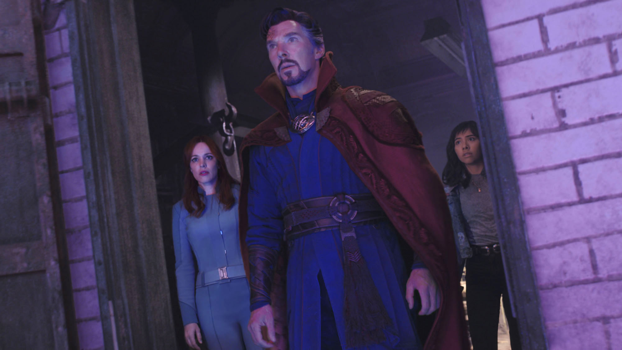 Stephen Strange (Benedict Cumberbatch), Christine Palmer (Rachel McAdams) and America Chavez (Xochitl Gomez) look ahead in Doctor Strange in the Multiverse of Madness.