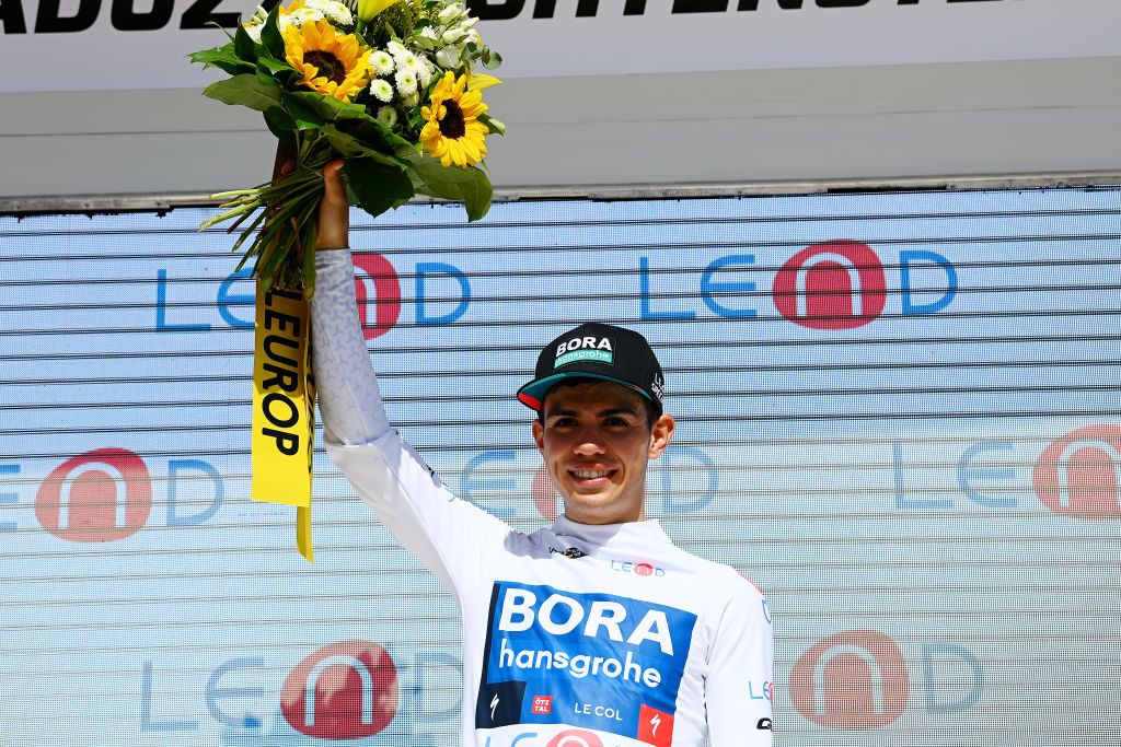 VADUZ LIECHTENSTEIN JUNE 19 Sergio Andres Higuita Garcia of Colombia and Team Bora Hansgrohe celebrates winning the white best young jersey on the podium ceremony after the 85th Tour de Suisse 2022 Stage 8 a 256km individual time trial stage from Vaduz to Vaduz tourdesuisse2022 WorldTour ITT on June 19 2022 in Vaduz Liechtenstein Photo by Tim de WaeleGetty Images