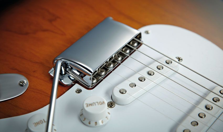 There's chrome hardware and vibrato/bridge cover - all is as it should be