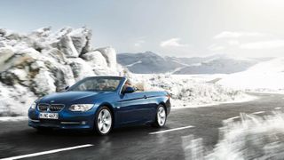 A BMW 3 series driving during winter