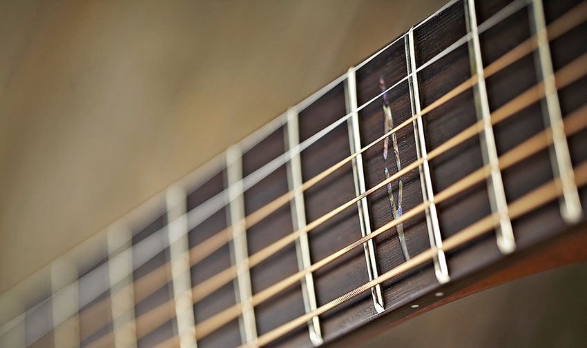 The bound rosewood necks of both guitars makes for good fretting and no visible fret ends