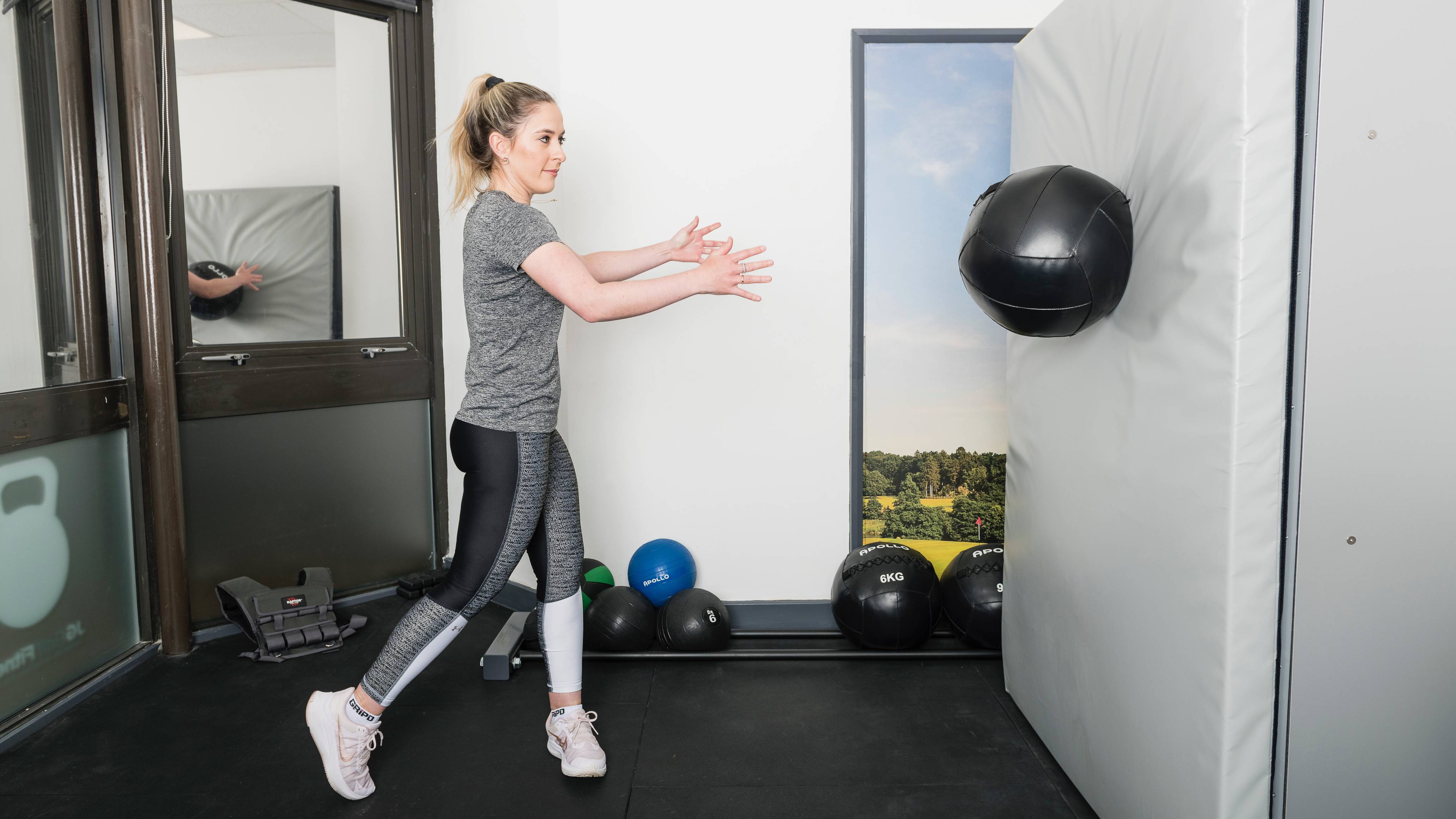 Female throwing a medicine ball