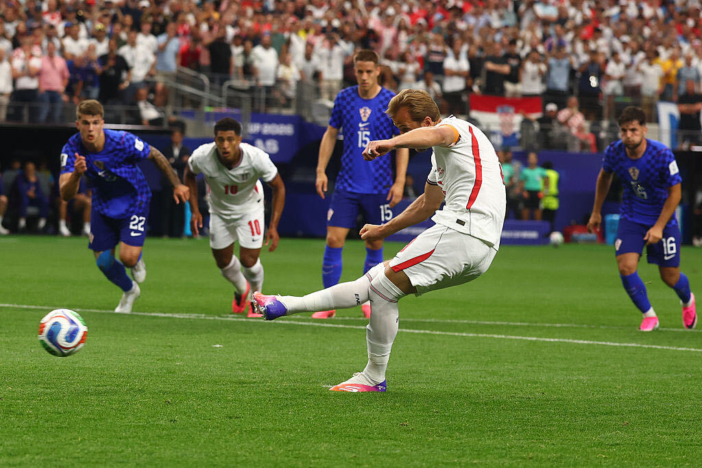 Harry Kane mid kick of a penalty vs Croatia.