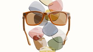 Orange RayBan Meta Smart Glasses in front of a wall of colorful lenses including green, blue, yellow and pink