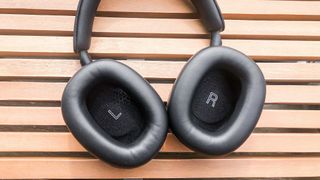 Bowers & Wilkins PX7 S2 showing left and right earcups on a table outside
